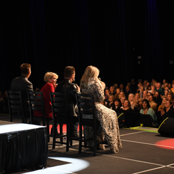 The stars chat with a room full of happy fans.